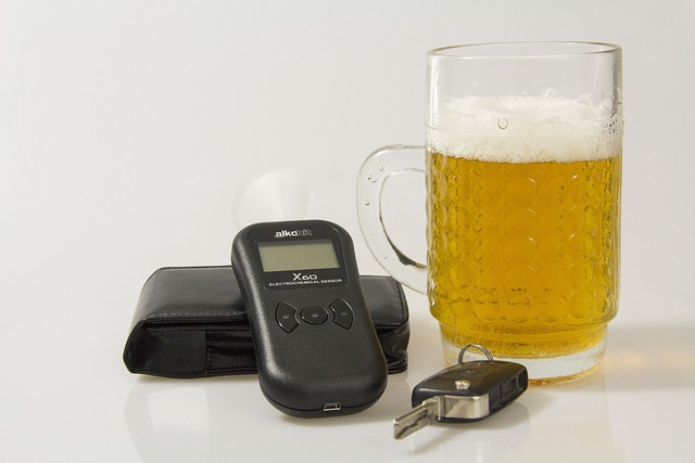Image showing alcohol and a breathalyzer, which is an important invention and a DUIT life saving technology.