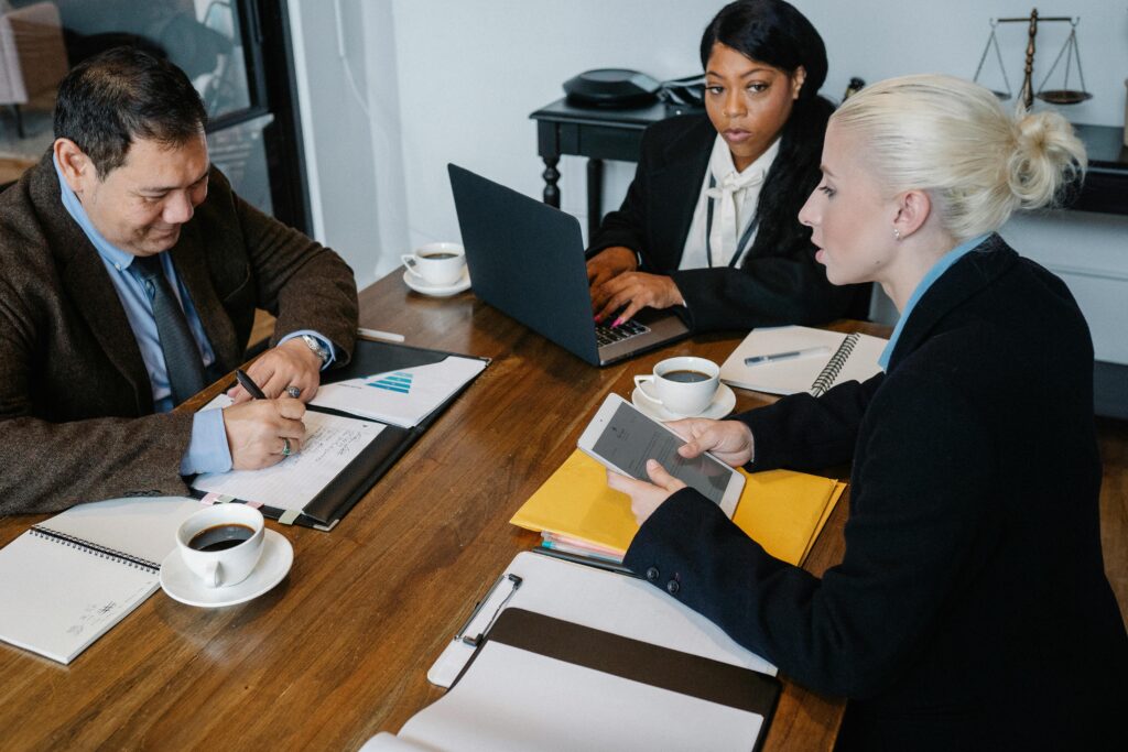 Someone has to read the Office Action, understand the legal logic, interpret what the examiner really wants, and then translate that into plain language for the business team.